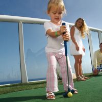 Children playing golf on a cruise ship