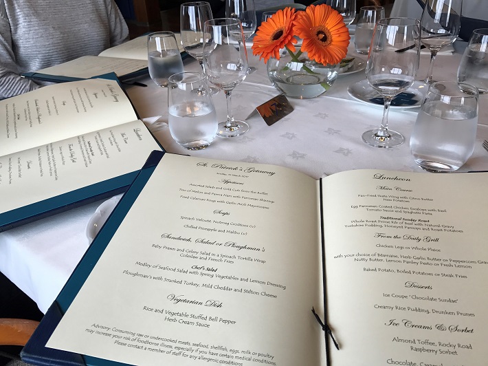 Diners seated with menus on-board Saga Pearl cruise ship