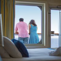 Couple on the balcony in the stateroom